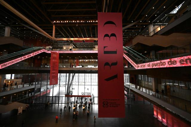 Visitors walk through the venue during the ARTBO International Art Fair in Bogota on September 24, 2026. (Photo by Raul ARBOLEDA / AFP)