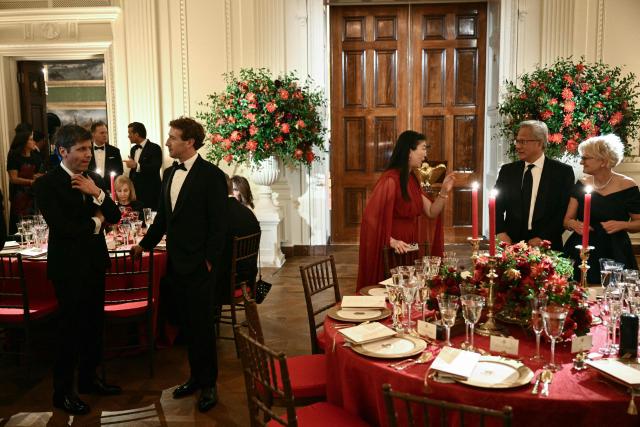 OpenAI CEO Sam Altman (L), Meta CEO Mark Zuckerberg (2nd/L), NVIDIA CEO Jensen Huang (2nd/R) and his wife Lori Huang (R) attend a state dinner hosted by US President Donald Trump for Chinese President Xi Jinping in the East Room of the White House in Washington, DC, on September 24, 2026. President Xi is on a State visit to the United States from September 23 to 25. (Photo by Brendan SMIALOWSKI / AFP)