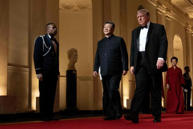 US President Donald Trump and China's President Xi Jinping arrive for a State Dinner in the East Room of the White House in Washington, DC, on September 24, 2026. President Xi is on a State visit to the United States from September 23 to 25. (Photo by Brendan Smialowski / AFP)