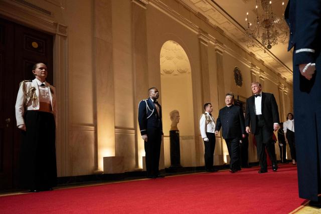 US President Donald Trump and China's President Xi Jinping arrive for a State Dinner in the East Room of the White House in Washington, DC, on September 24, 2026. President Xi is on a State visit to the United States from September 23 to 25. (Photo by Brendan Smialowski / AFP)
