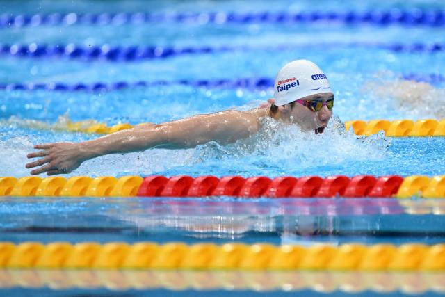 Taiwan's Wang Kuan-hung competes in the final of the men's 200m butterfly swimming event during the 2026 Asian Games at the Tokyo Aquatics Centre in Tokyo on September 25, 2026. (Photo by ANDREW CABALLERO-REYNOLDS / AFP)
