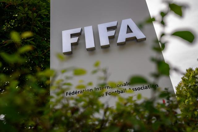 (FILES) This general view shows a FIFA sign at the entrance of world football's governing body headquarters in Zurich on August 27, 2026. The four main European football leagues -- the English Premier League, Spain's La Liga, Italy's Serie A and Germany's Bundesliga -- called on September 25, 2026, for a reform of FIFA. The sport's governing body has been mired in crisis since the revelation of a shelved plan to create a commercial company open to private investors. (Photo by Fabrice COFFRINI / AFP)