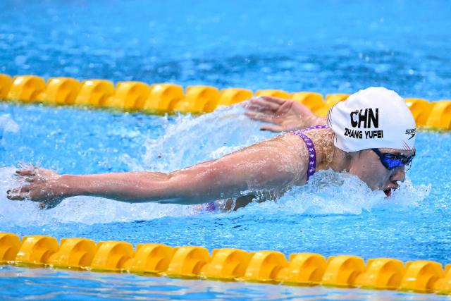 China's Zhang Yufei competes in the final of the women's 4 x 100m medley relay swimming event during the 2026 Asian Games at the Tokyo Aquatics Centre in Tokyo on September 25, 2026. (Photo by Yuichi YAMAZAKI / AFP)