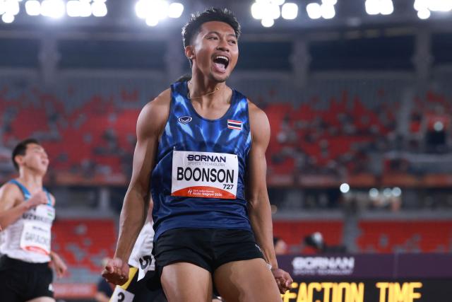 Thailand's Puripol Boonson celebrates after winning the men's 100m semifinal during the 2026 Asian Games at Nagoya City Mizuho Park Athletic Stadium in Nagoya, Aichi Prefecture on September 25, 2026. (Photo by DAVID GRAY / AFP)