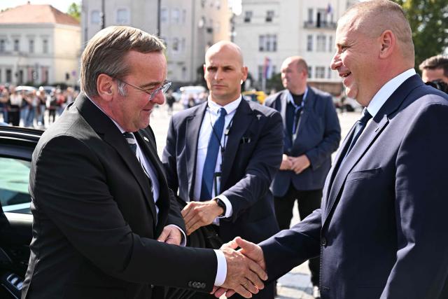 Hungary's Defence Minister Romulusz Ruszin-Szendi (R) welcomes Germany's Defence Minister Boris Pistorius (L) with military honors in Budapest on September 25, 2026, during Pistorius's one-day visit to Hungary for talks on defence cooperation and European security. (Photo by Attila KISBENEDEK / AFP)