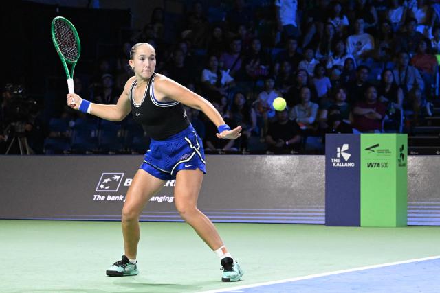 Russia's Mirra Andreeva hits a return against Canada's Leyla Fernandez during the WTA Singapore Open Tennis quarterfinal in Singapore on September 25, 2026. (Photo by Roslan RAHMAN / AFP)