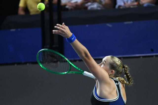 Russia's Mirra Andreeva serves against Canada's Leyla Fernandez during the WTA Singapore Open Tennis quarterfinal in Singapore on September 25, 2026. (Photo by Roslan RAHMAN / AFP)