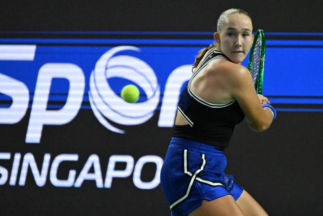Russia's Mirra Andreeva hits a return against Canada's Leyla Fernandez during the WTA Singapore Open Tennis quarterfinal in Singapore on September 25, 2026. (Photo by Roslan RAHMAN / AFP)