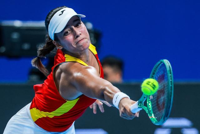 Spain’s Jessica Bouzas Maneiro hits a return to Czech Republic’s Karolina Muchova during their women’s singles semi-final match at the Billie Jean King Cup tennis tournament in Shenzhen, in China’s southern Guangdong province on September 25, 2026. (Photo by CN-STR / AFP) / China OUT
