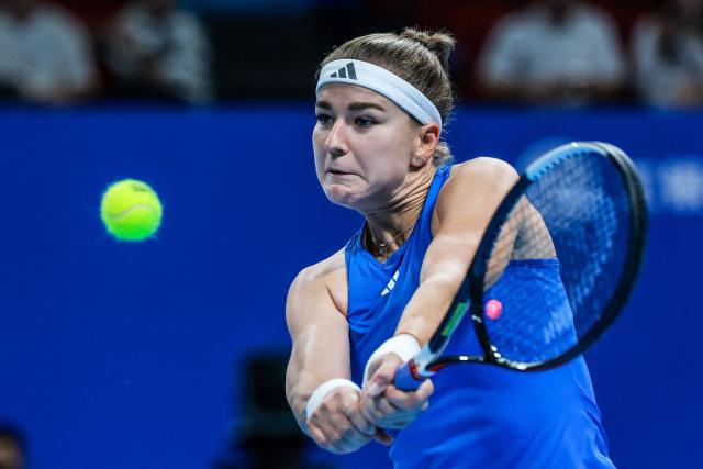 Czech Republic’s Karolina Muchova hits a return to Spain’s Jessica Bouzas Maneiro during their women’s singles semi-final match at the Billie Jean King Cup tennis tournament in Shenzhen, in China’s southern Guangdong province on September 25, 2026. (Photo by CN-STR / AFP) / China OUT