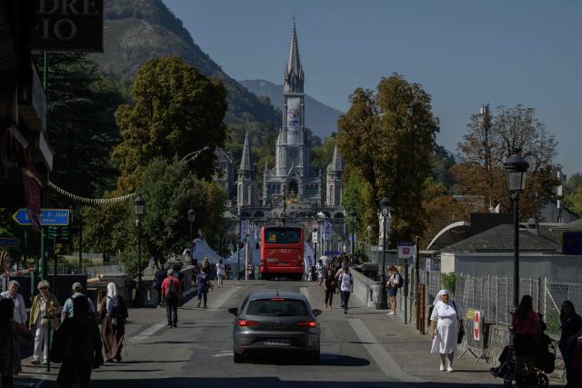 This photograph shows a general view of the Basilica of our Lady of the Rosary in Lourdes, south-western France, a day ahead of the Pope's visit, on September 25, 2026. On the first official papal trip in 18 years to a proudly secular country that has since 1901 separated church and state, Pope Leo will visit Lourdes, a pilgrimage site for Christians worldwide where he will privately meet victims of clerical sex abuse, and Metz, near the German border, where he is to further speak about peace in Europe. (Photo by Ed JONES / AFP)