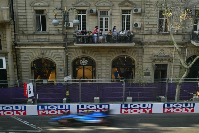 Spectators follow the qualifying session of the Formula One Azerbaijan Grand Prix at the Baku City Circuit in Baku on September 25, 2026. (Photo by Andrej ISAKOVIC / AFP)