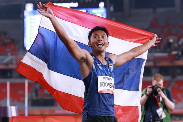 Thailand's Puripol Boonson celebrates after setting a new games record in the men's 100m final during the 2026 Asian Games at Nagoya City Mizuho Park Athletic Stadium in Nagoya, Aichi Prefecture on September 25, 2026. (Photo by DAVID GRAY / AFP)