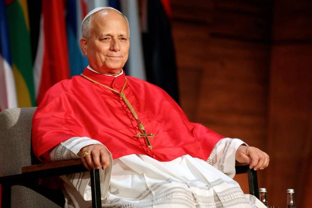 Pope Leo XIV reacts as he sits on stage prior to deliver a speech during a visit at the UNESCO headquarters, in Paris on September 25, 2026 as part of his four days trip to France. (Photo by Thomas SAMSON / AFP)