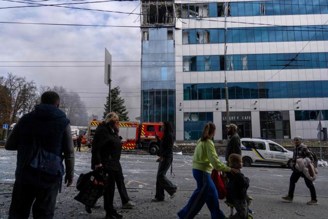 Pedestrians walk past a heavily damaged office building following an air attack in Kyiv on September 25, 2026, amid the Russian invasion of Ukraine. Russian daytime strikes on Kyiv killed five people on September 25, 2026, local authorities said, the latest in a wave of intensifying attacks on the war-torn capital. Kyiv has faced increasing drone and missiles strikes in recent months, prompting renewed calls for air defence systems, including for advanced Patriot air defence systems that Ukraine hopes to produce with US licences. (Photo by OLEKSII FILIPPOV / AFP)