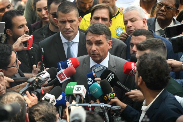 Brazil's senator and presidential candidate for the Liberal Party (PL) Flavio Bolsonaro speaks with the media after a graduation ceremony at the Center of Improvement and Training of Soldiers (CFAP) at Sulacap neighbourhood in Rio de Janeiro, Brazil, on September 25, 2026. Brazil will hold presidential election on October 4, 2026. (Photo by MAURO PIMENTEL / AFP)