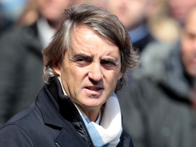 (FILES) Manchester City's Italian manager Roberto Mancini takes his seat for the English Premier League football match between Manchester City and West Ham United at the Etihad Stadium in Manchester, northwest England, on April 27, 2013. Manchester City have been found guilty of all but one of 115 Premier League charges they face for breaching financial regulations, the Athletic reported on Friday, September 25, 2026. (Photo by LINDSEY PARNABY / AFP)