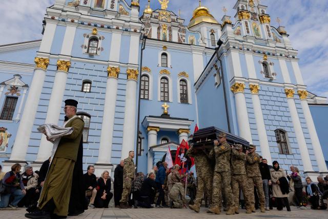 Ukrainian servicemen carry the coffin of Mykola Karpyuk, a Ukrainian serviceman, public and political figure and former political prisoner of the Kremlin who was killed in combat during the Russian invasion of Ukraine, at a funeral ceremony at St Michael's Golden-Domed Monastery in Kyiv on September 25, 2026. (Photo by Tetiana DZHAFAROVA / AFP)