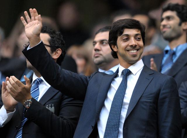 (FILES) Manchester city owner Sheikh Mansour bin Zayed Al Nahyan (C) looks on during the English Premier League football match against Liverpool at The City of Manchester stadium, Manchester, north-west England on August 23, 2010. Manchester City have been found guilty of all but one of 115 Premier League charges they face for breaching financial regulations, the Athletic reported on Friday, September 25, 2026. (Photo by Andrew YATES / AFP)