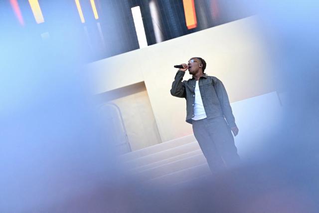 French gospel rapper "Tagra" performs during a prayer vigil with young people lead by Pope Leo XIV at the Stade de France stadium, in Saint-Denis on the outskirts of Paris on September 25, 2026 as part of his four days visit to France. (Photo by LOU BENOIST / AFP)