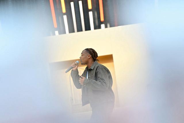 French gospel rapper "Tagra" performs during a prayer vigil with young people lead by Pope Leo XIV at the Stade de France stadium, in Saint-Denis on the outskirts of Paris on September 25, 2026 as part of his four days visit to France. (Photo by LOU BENOIST / AFP)