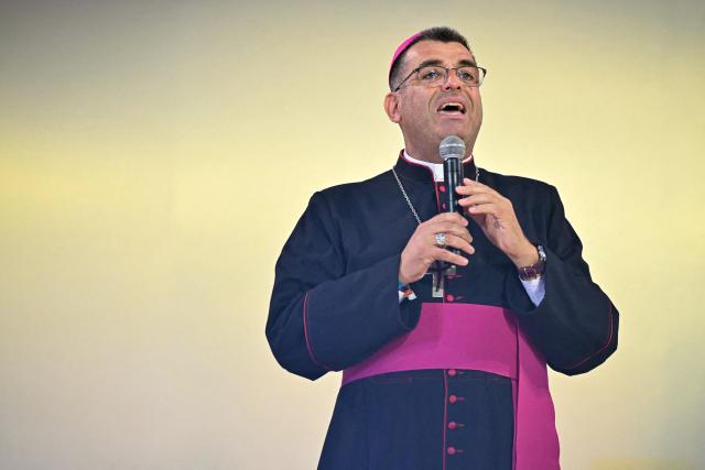 French bishop Etienne Guillet gives a speech as part of a prayer vigil with young people led by Pope Leo XIV at the Stade de France stadium, in Saint-Denis on the outskirts of Paris on September 25, 2026 as part of his four days visit to France. (Photo by LOU BENOIST / AFP)