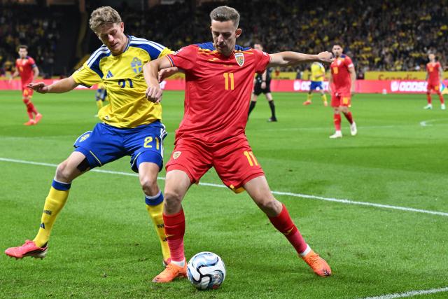 Sweden's midfielder Alexander Bernhardsson (L) and Romania's defender Nicusor Silviu Bancu vie for the ball during the UEFA Nations League Group B4 football match between Sweden and Romania in Solna, Sweden on September 25, 2026. (Photo by Jonathan Nackstrand / AFP)