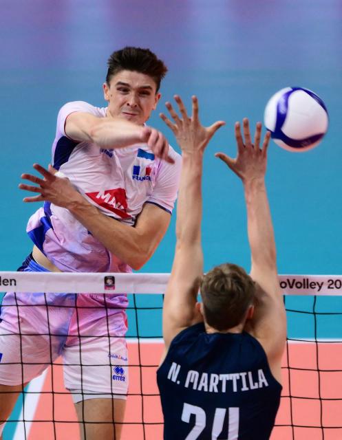 France's Opposite Hitter #21 Theo Faure spikes the ball during the CEV EuroVolley 2026 men's semifinal volleyball match between Finland and France at the Forum of Assago, on September 25, 2026. (Photo by Marco BERTORELLO / AFP)