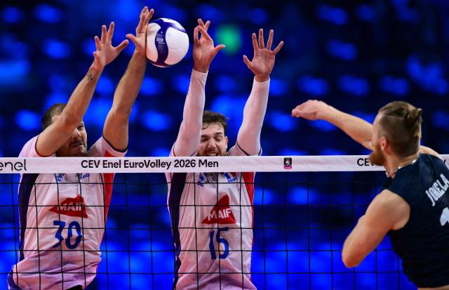 France's Middle Blocker #30 Francois Huetz blocks the ball during the CEV EuroVolley 2026 men's semifinal volleyball match between Finland and France at the Forum of Assago, on September 25, 2026. (Photo by Marco BERTORELLO / AFP)