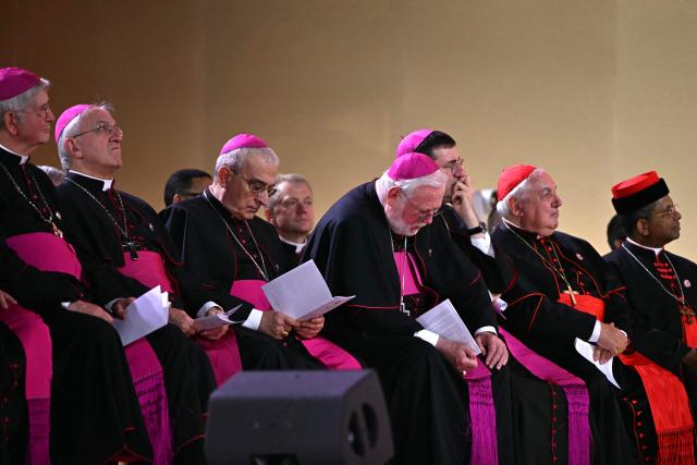 French archbishop Laurent Ulrich, Apostolic Nuncio to France Archbishop Celestino Migliore, French archbishop Jean-Marc Aveline listen to Pope Leo XIV during a prayer vigil with young people at the Stade de France stadium, in Saint-Denis on the outskirts of Paris on September 25, 2026 as part of his four days visit to France. (Photo by LOU BENOIST / AFP)