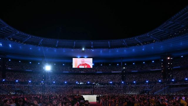Pope Leo XIV is seen on a screen as he leads a prayer vigil with young people at the Stade de France stadium, in Saint-Denis on the outskirts of Paris on September 25, 2026 as part of his four days visit to France. (Photo by LOU BENOIST / AFP)