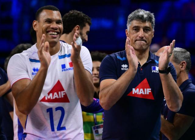 France’s Head coach Andrea Giani and France's Opposite Hitter #12 Stephen Boyer celebrate after winning in the CEV EuroVolley 2026 men's semifinal volleyball match between Finland and France at the Forum of Assago, on September 25, 2026. (Photo by Marco BERTORELLO / AFP)