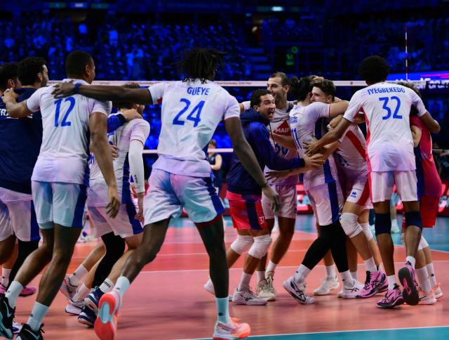 France's players celebrate after winning in the CEV EuroVolley 2026 men's semifinal volleyball match between Finland and France at the Forum of Assago, on September 25, 2026. (Photo by Marco BERTORELLO / AFP)