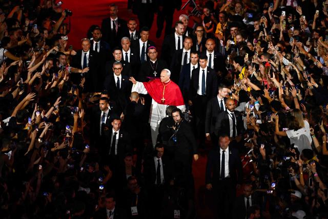 Pope Leo XIV waves to the crowd as he leaves at the end of a prayer vigil with young people at the Stade de France stadium, in Saint-Denis on the outskirts of Paris on September 25, 2026 as part of his four days visit to France. (Photo by JULIEN DE ROSA / AFP)