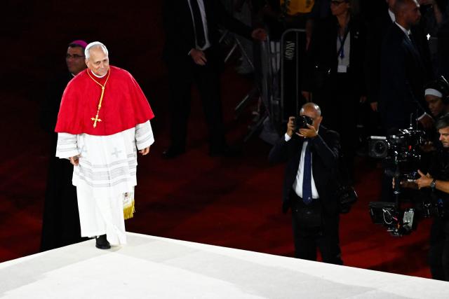 Pope Leo XIV leaves at the end of a prayer vigil with young people at the Stade de France stadium, in Saint-Denis on the outskirts of Paris on September 25, 2026 as part of his four days visit to France. (Photo by JULIEN DE ROSA / AFP)
