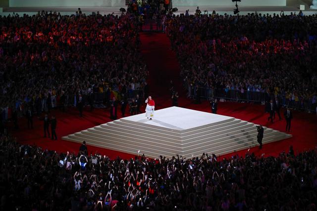 Pope Leo XIV waves to the crowd as he leaves at the end of a prayer vigil with young people at the Stade de France stadium, in Saint-Denis on the outskirts of Paris on September 25, 2026 as part of his four days visit to France. (Photo by JULIEN DE ROSA / AFP)