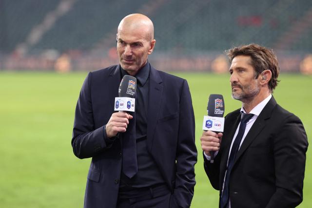 France's head coach Zinedine Zidane (L) gives an interview to former France football international and sports commentator Bixente Lizarazu after his first match as France manager following the UEFA Nations League (League A, Group 1) first leg football match between Turkey and France at the Kocaeli Stadium in Izmit, on September 25, 2026. (Photo by FRANCK FIFE / AFP)