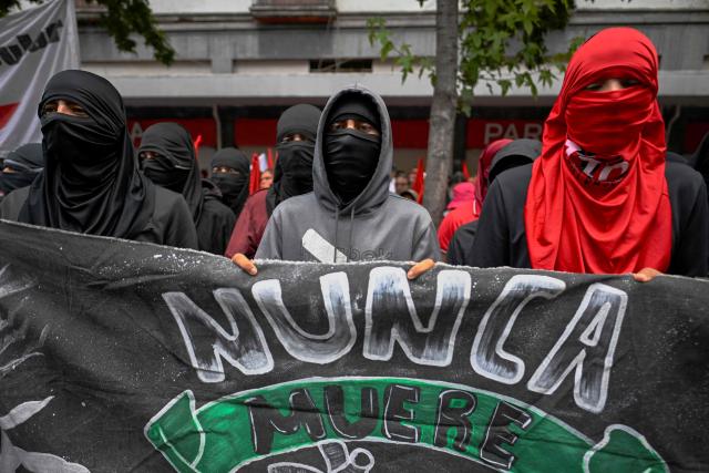 A demonstrator protests outside the Supreme Court of Justice of the Nation in Mexico City on September 25, 2026, a few days before the 12th anniversary of the disappearance of the 43 Ayotzinapa students. The 43 students from a teachers' college disappeared on September 26, 2014, while traveling by bus through the state of Guerrero to take part in a demonstration in Mexico City. (Photo by Alfredo ESTRELLA / AFP)