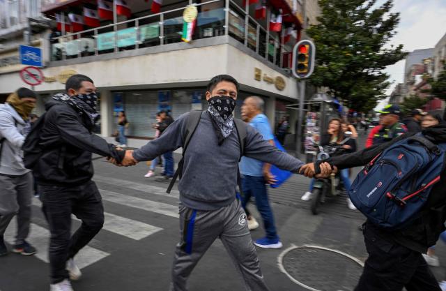 Demonstrators protest outside the Supreme Court of Justice of the Nation in Mexico City on September 25, 2026, a few days before the 12th anniversary of the disappearance of the 43 Ayotzinapa students. The 43 students from a teachers' college disappeared on September 26, 2014, while traveling by bus through the state of Guerrero to take part in a demonstration in Mexico City. (Photo by Alfredo ESTRELLA / AFP)