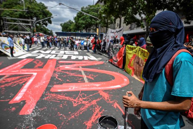 Demonstrators protest outside the Supreme Court of Justice of the Nation in Mexico City on September 25, 2026, a few days before the 12th anniversary of the disappearance of the 43 Ayotzinapa students. The 43 students from a teachers' college disappeared on September 26, 2014, while traveling by bus through the state of Guerrero to take part in a demonstration in Mexico City. (Photo by Alfredo ESTRELLA / AFP)