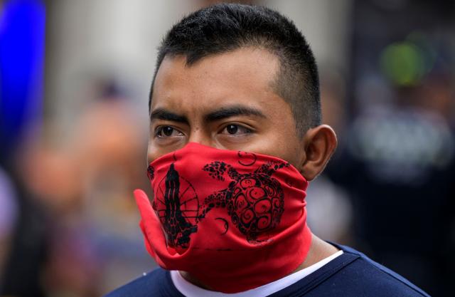 A demonstrator protests outside the Supreme Court of Justice of the Nation in Mexico City on September 25, 2026, a few days before the 12th anniversary of the disappearance of the 43 Ayotzinapa students. The 43 students from a teachers' college disappeared on September 26, 2014, while traveling by bus through the state of Guerrero to take part in a demonstration in Mexico City. (Photo by Alfredo ESTRELLA / AFP)