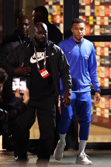 France's forward #10 Kylian Mbappe (R) leaves the Kocaeli Stadium after the UEFA Nations League (League A, Group 1) first leg football match between Turkey and France in Izmit, on September 25, 2026. (Photo by FRANCK FIFE / AFP)
