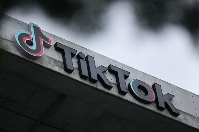 (FILES) The TikTok logo is displayed outside TikTok social media app company offices in Culver City, California, on March 16, 2023. TikTok on September 25 agreed to a settlement with Alabama just days before a trial was set to begin over claims the company misled parents about tools meant to shield children from harmful content. "Under the settlement, Alabama will receive a minimum of $100 million, due to the state within 45 days, with the potential to receive up to $300 million if certain conditions are met," the office of the attorney general in the southern US state said in a statement. (Photo by Patrick T. Fallon / AFP)