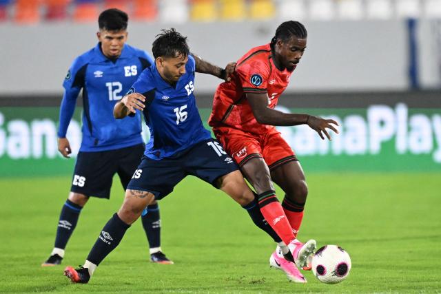 El Salvador's defender #16 Diego Flores and Martinique's midfielder #08 Kevin Appin fight for the ball during the Concacaf Nations League Cup football match between El Salvador and Martinique, at the Jorge 'El Magico' Gonzalez stadium in San Salvador, on September 25, 2026. (Photo by MARVIN RECINOS / AFP)