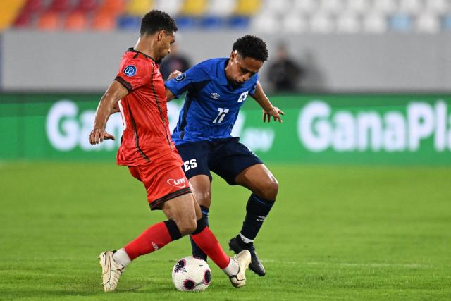 Martinique's defender #13 Kenry Lala and El Salvador's midfielder #11 Mayer Gil fight for the ball during the Concacaf Nations League Cup football match between El Salvador and Martinique, at the Jorge 'El Magico' Gonzalez stadium in San Salvador, on September 25, 2026. (Photo by MARVIN RECINOS / AFP)