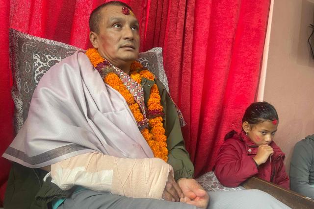 Nepali flood survivor Kabir Maharjan, who was rescued from a hydropower project tunnel, takes part in an interview AFP at his home in Kirtipur on September 25, 2026, after being discharged from hospital. Pulled alive 10 days after catastrophic floods trapped him in a tunnel, Nepali hydropower worker Kabir Maharjan is determined to help rebuild his country despite his own harrowing ordeal. (Photo by ANUP OJHA / AFP) / To go with 'NEPAL-CHINA-LANDSLIDE-FLOOD-SURVIVOR-RECONSTRUCTION,INTERVIEW' by Anup OJHA