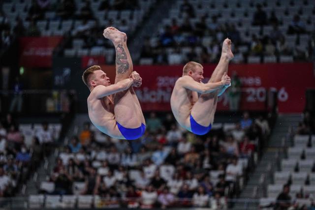 Uzbekistan's diver Vyacheslav Kachanov and Uzbekistan's diver Igor Myalin compete in the men's synchronised 3m springboard final diving event during the 2026 Asian Games at the Tokyo Aquatics Centre in Tokyo on September 26, 2026. (Photo by Yuichi YAMAZAKI / AFP)