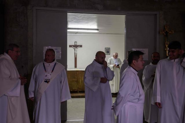 Worshippers and prelates gather for a mass at the basilique Saint Pie, in Lourdes on September 26, 2026. (Photo by Ed JONES / AFP)