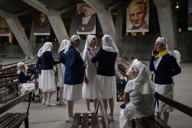 Worshippers gather for a mass at the basilique Saint Pie, in Lourdes on September 26, 2026. (Photo by Ed JONES / AFP)