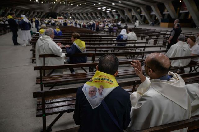 Worshippers and prelates gather for a mass at the basilique Saint Pie, in Lourdes on September 26, 2026. (Photo by Ed JONES / AFP)